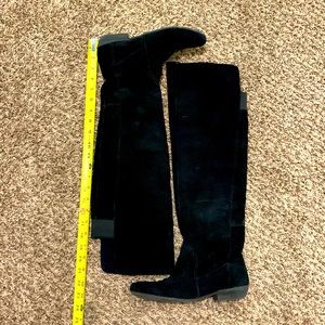 Tall black suede boots
